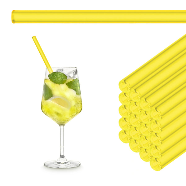 Neon yellow 20 cm HALM glass straws stacked beside a Limoncello Spritz in a wine glass